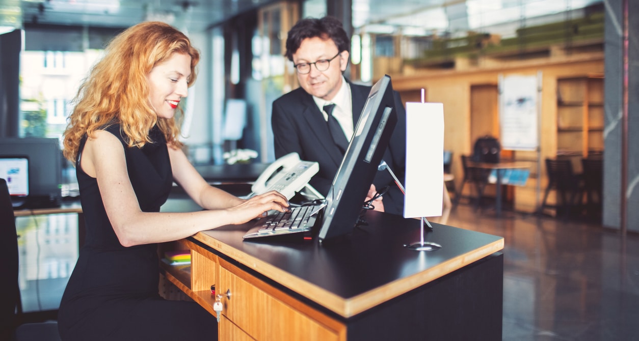 Bank receptionist helping customer, businessman